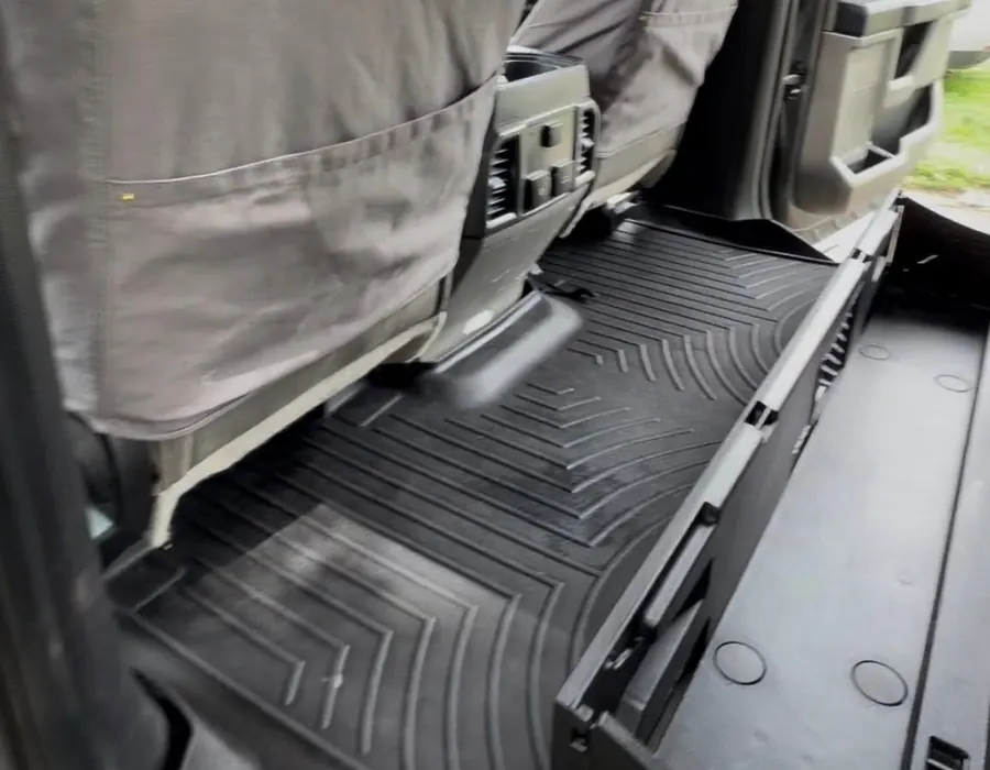 Clean rear floor liner and seats in a pickup after an interior detail by González Auto Detailing